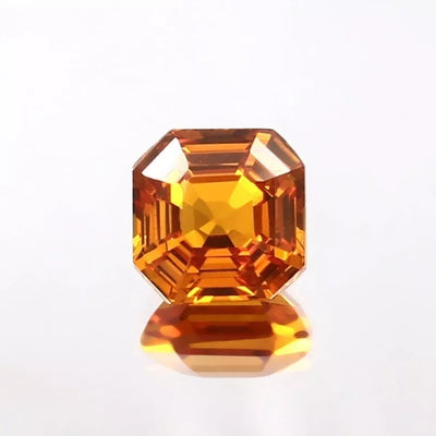 Faceted Ceylon Fanta Orange Sapphire Untreated gemstone on a white background