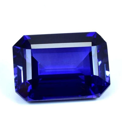 Faceted blue Sapphire gemstone on a white background