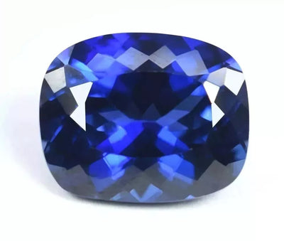 Cushion-shaped Ceylon Blue Sapphire gemstone on a white background