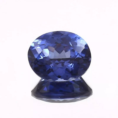 Faceted Royal Blue Sapphire gemstone on a white background