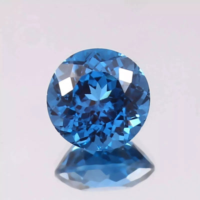 Indicolite Blue Color Tourmaline gemstone on a light gray background